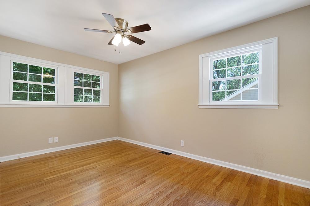 210 Pitt Lane Springfield, TN 37172 - Photo 14 of 27 an empty room with wooden floor and windows