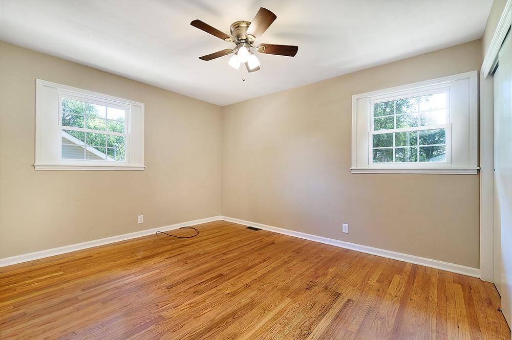 210 Pitt Lane Springfield, TN 37172 - Photo 18 of 27 a view of an empty room with wooden floor and a window
