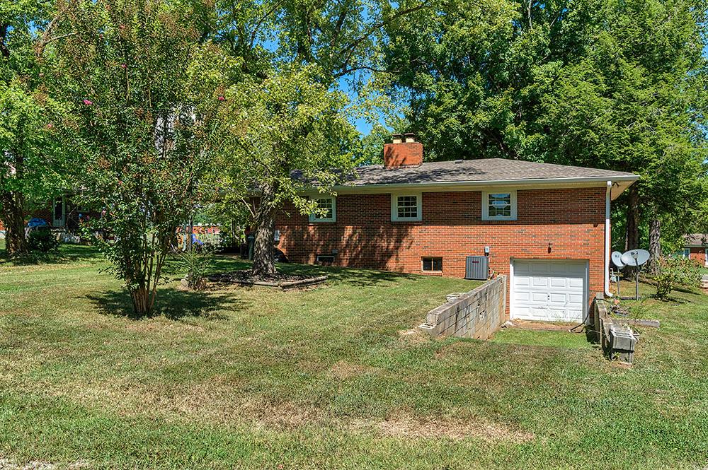210 Pitt Lane Springfield, TN 37172 - Photo 27 of 27 a front view of a house with a yard garage and outdoor seating