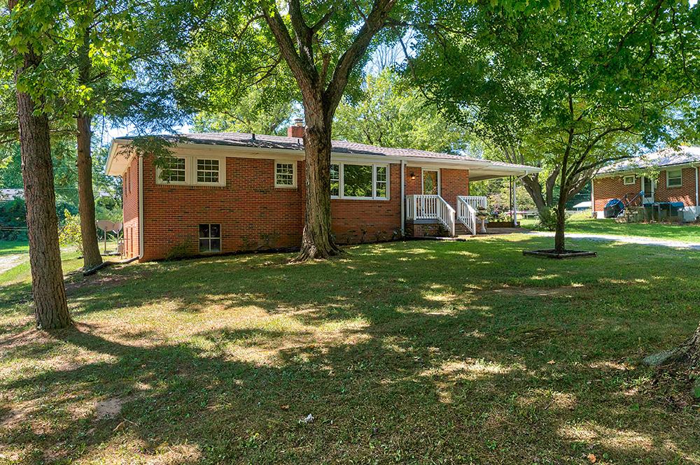 210 Pitt Lane Springfield, TN 37172 - Photo 4 of 27 a view of a yard in front of a house with large tree