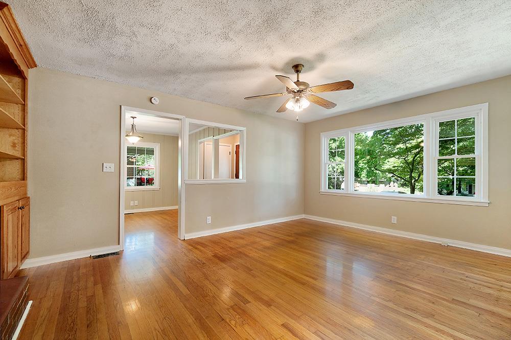 210 Pitt Lane Springfield, TN 37172 - Photo 7 of 27 a view of an empty room with wooden floor and a window