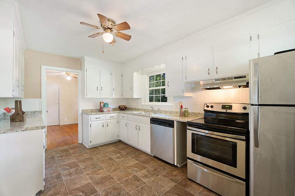 210 Pitt Lane Springfield, TN 37172 - Photo 8 of 27 a kitchen with a stove sink and refrigerator