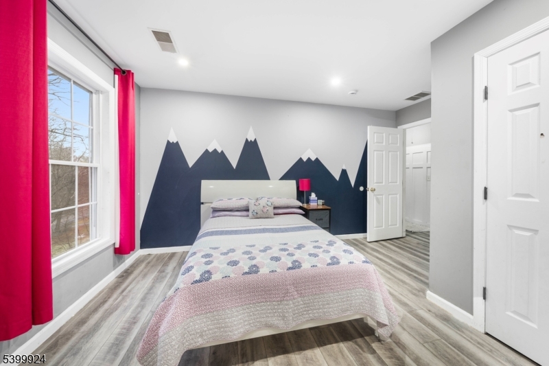 123 Vail Road Columbia, NJ 07832 - Photo 22 of 44 a bedroom with a bed and a large window