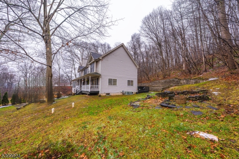 123 Vail Road Columbia, NJ 07832 - Photo 33 of 44 a view of a house with a yard