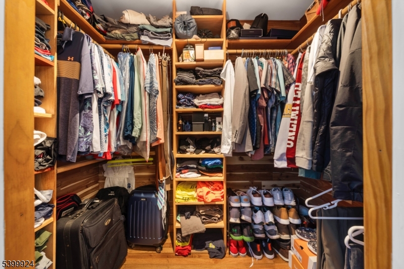 123 Vail Road Columbia, NJ 07832 - Photo 38 of 44 a view of walk in closet with clothes and shoes