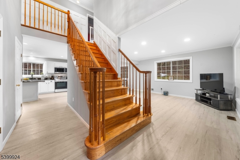 123 Vail Road Columbia, NJ 07832 - Photo 5 of 44 a view of a livingroom with furniture and staircase