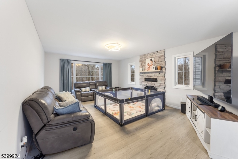 123 Vail Road Columbia, NJ 07832 - Photo 10 of 44 a living room with furniture and a fireplace