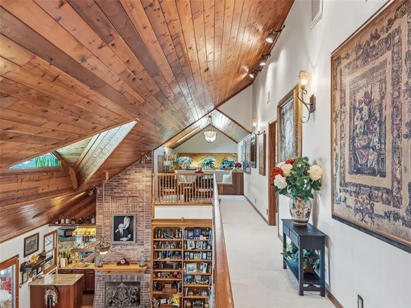 a bedroom with a bed couch and window
