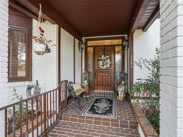 a view of porch with a bench