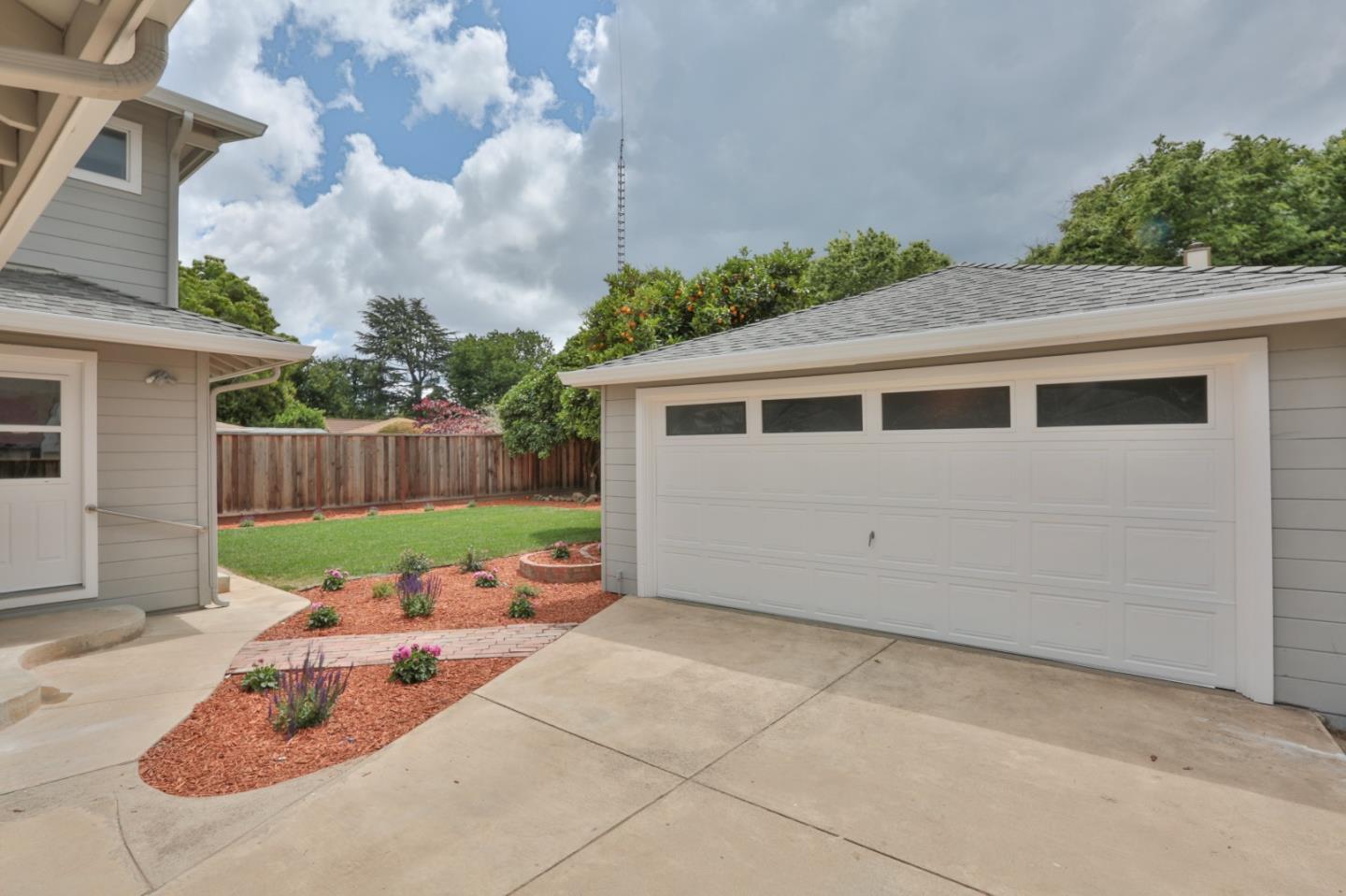 1663 Cross Way San Jose, CA 95125 - Photo 23 of 25 a view of a backyard with plants and a patio