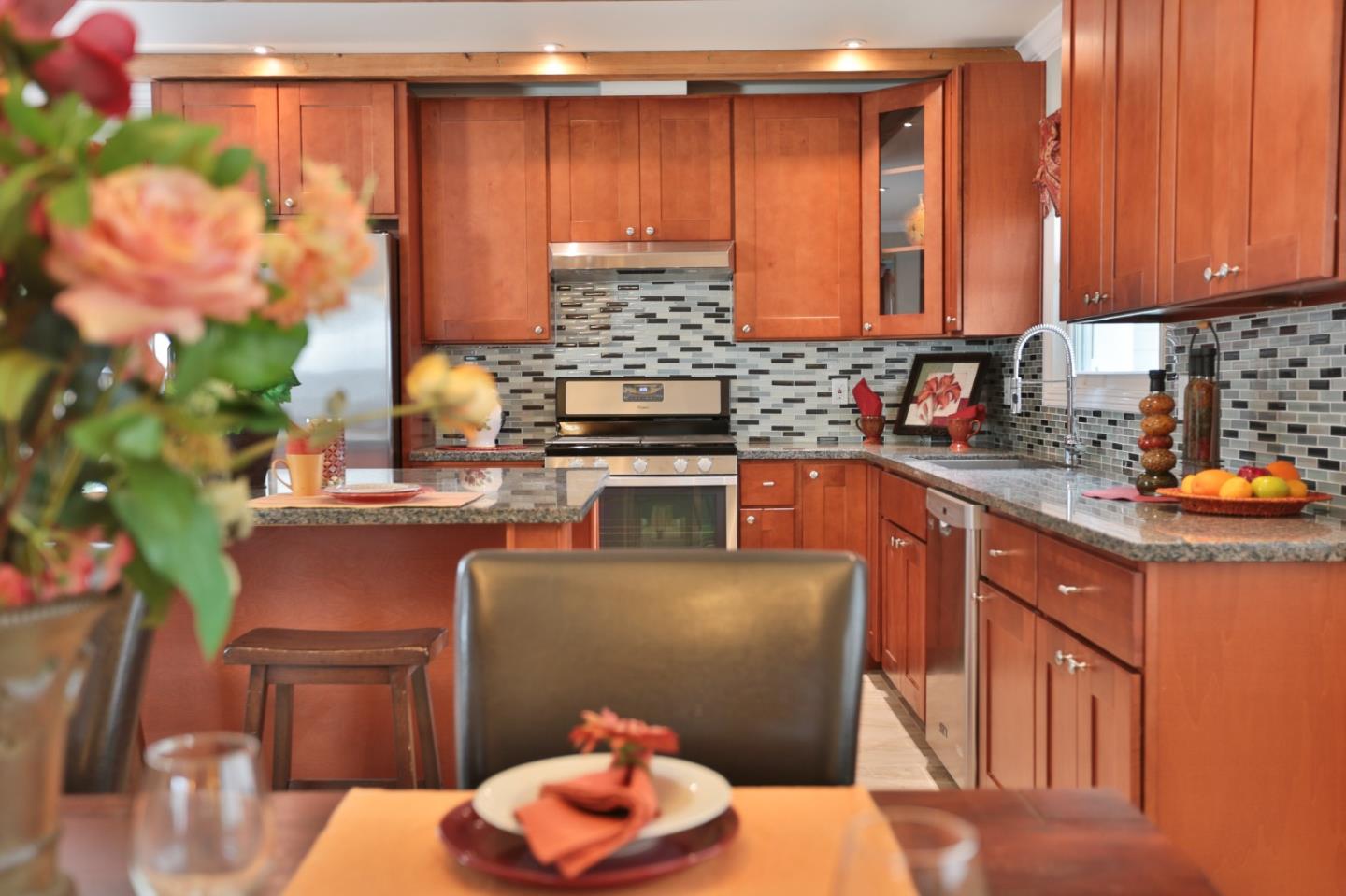1663 Cross Way San Jose, CA 95125 - Photo 5 of 25 a kitchen with stainless steel appliances wooden cabinets a stove a sink and a microwave