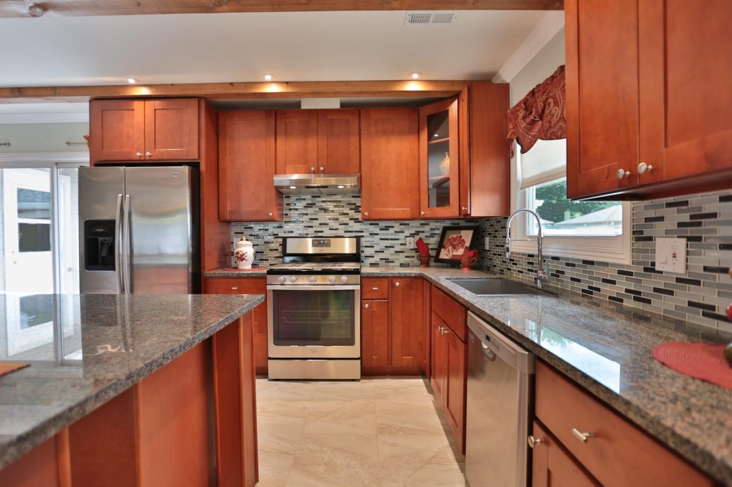 1663 Cross Way San Jose, CA 95125 - Photo 6 of 25 a kitchen with stainless steel appliances granite countertop a stove a sink and a refrigerator