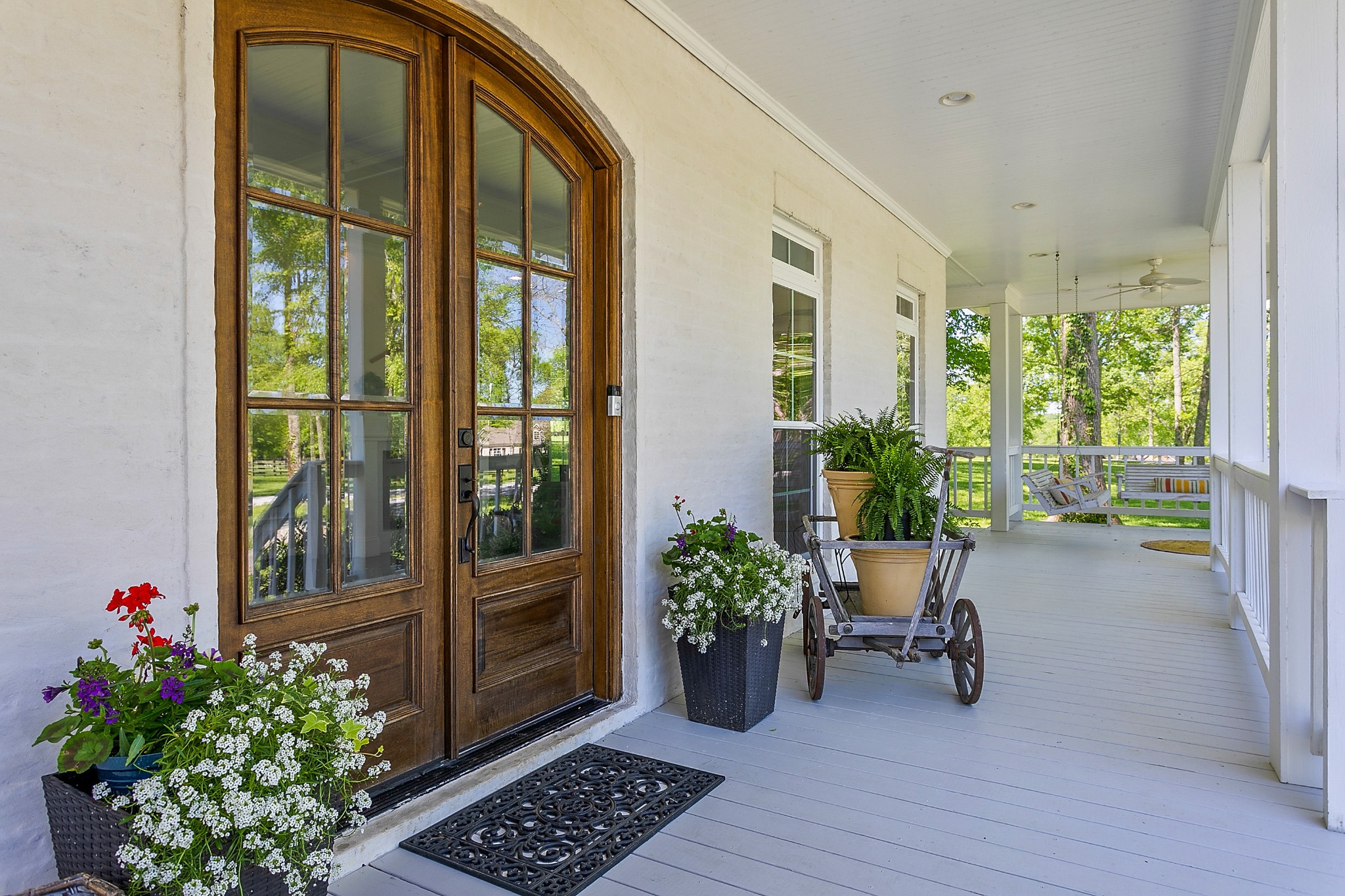 4280 Central Valley Road Murfreesboro, TN 37129 - Photo 11 of 50 Welcome your lucky visitors through this stately set of arched double wood doors, featuring panel glass and black hardware.