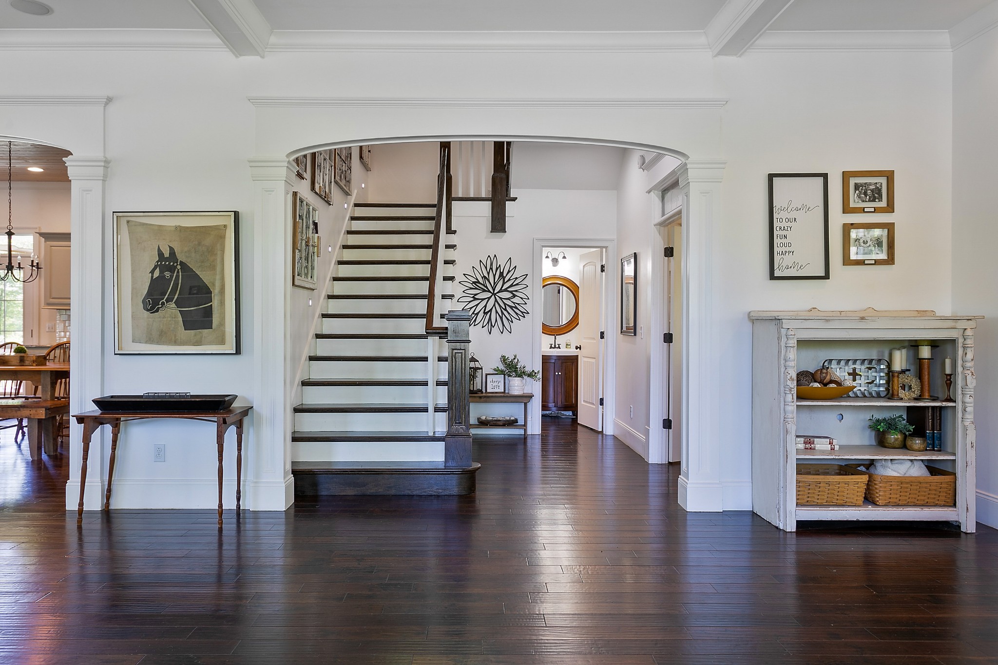 4280 Central Valley Road Murfreesboro, TN 37129 - Photo 12 of 50 This foyer is generous and impressive. You'll notice the continuation of large arched doorways with heavenly detailed headers, cornices, and side casing. Crisp white baseboards and trim work complement the dark hand-hewn wood floors.
