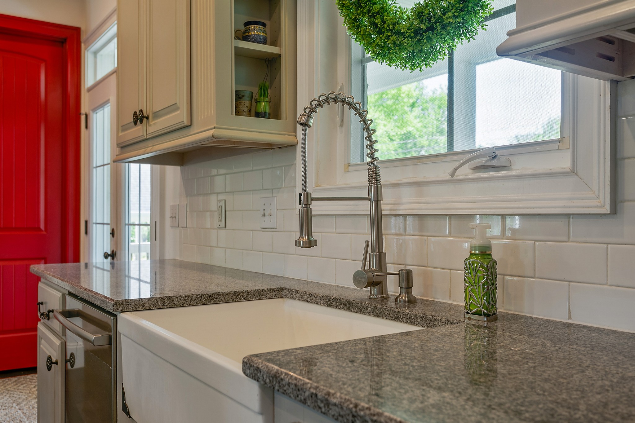 4280 Central Valley Road Murfreesboro, TN 37129 - Photo 18 of 50 Of course, a true farmhouse must have an oversized farmhouse sink...this kitchen does not disappoint. Stainless steel brushed fixtures and appliances complement the granite counters. Imagine the views from this window!