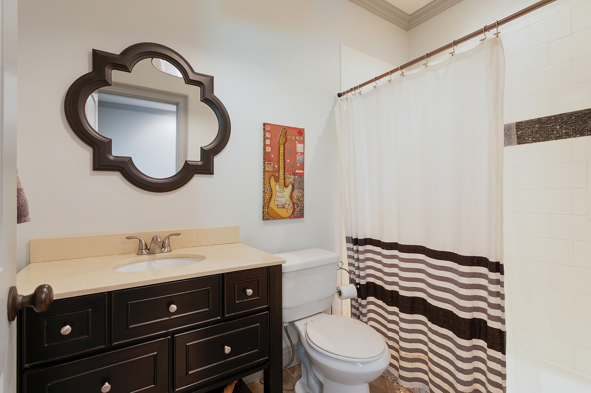 4280 Central Valley Road Murfreesboro, TN 37129 - Photo 33 of 50 This guest bathroom is located upstairs next to the bonus room and bar area, it features a large vanity and a tiled shower/tub combo.