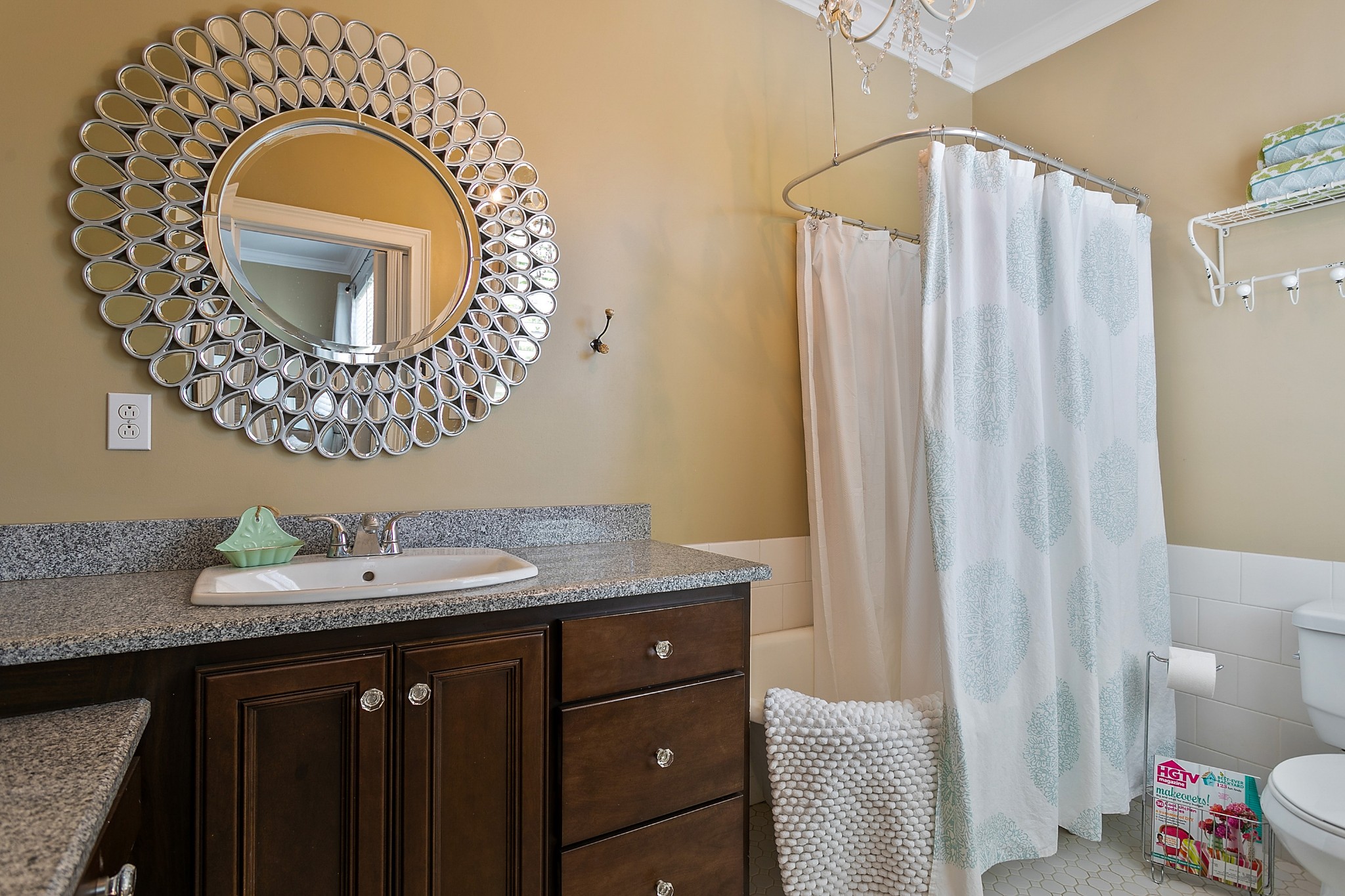 4280 Central Valley Road Murfreesboro, TN 37129 - Photo 38 of 50 This sweet bathroom features a corner vanity with granite countertops and lots of storage. The vintage-like white tile compliments the freestanding clawfoot tub perfectly. The chandelier is the icing on the cake.