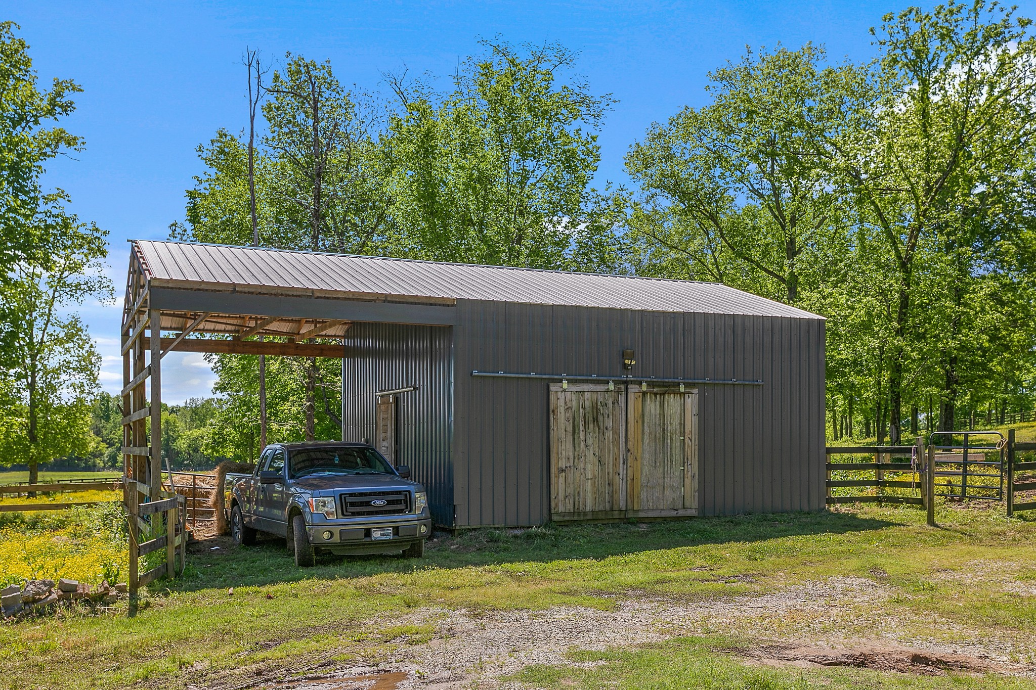 4280 Central Valley Road Murfreesboro, TN 37129 - Photo 43 of 50 This aluminum barn with electricity sits along the fenced horse pasture and has a generous outdoor covered space. The current owners are presently boarding two horses.