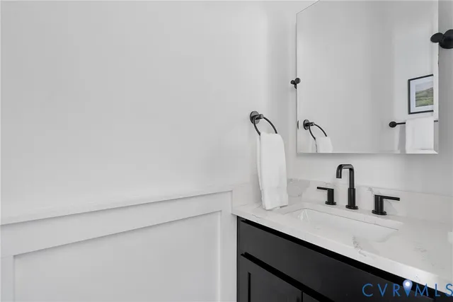 a bathroom with a sink and mirror
