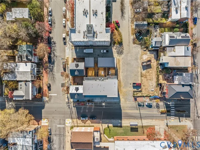an aerial view of residential houses with outdoor space