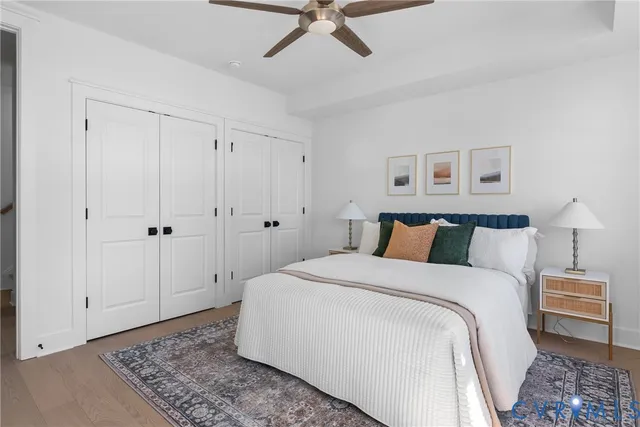 a bedroom with a bed and a rug