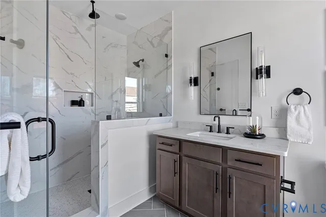 a bathroom with double vanity sink and mirror