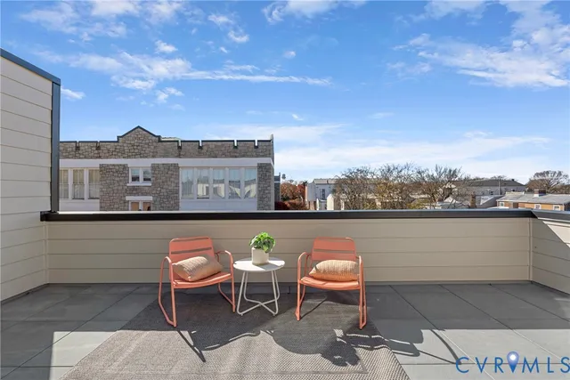 a view of a terrace with furniture