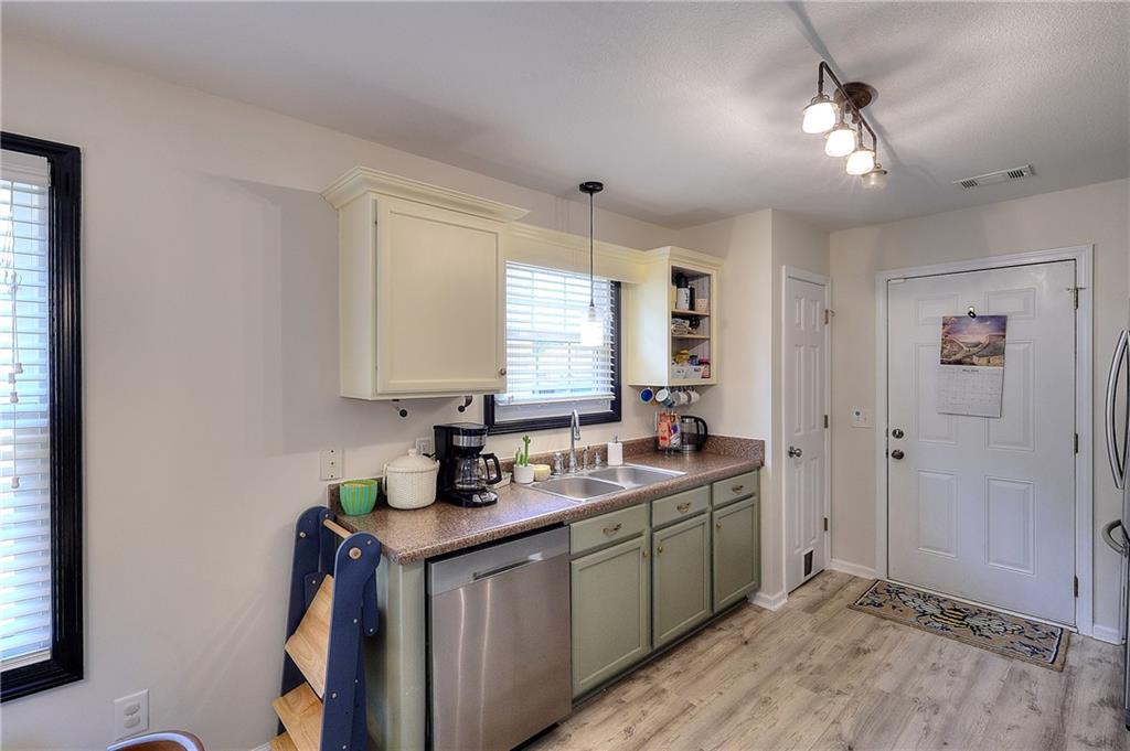 148 Alice Walker Drive Athens, GA 30607 - Photo 12 of 28 a kitchen with a sink and cabinets