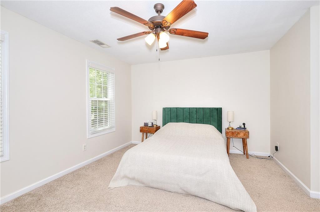148 Alice Walker Drive Athens, GA 30607 - Photo 13 of 28 a bedroom with a bed and window