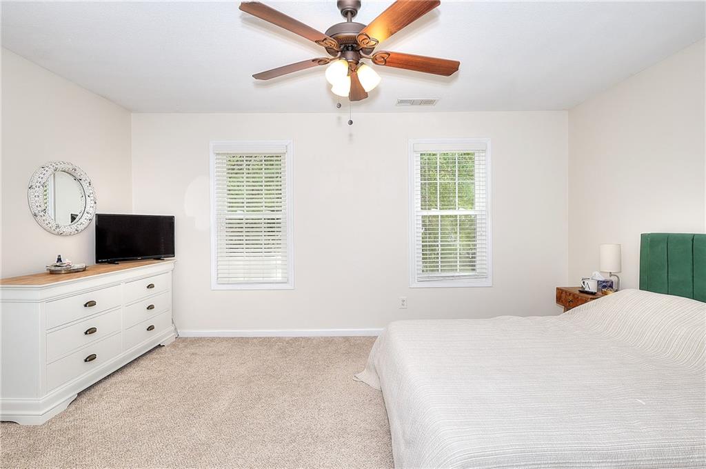 148 Alice Walker Drive Athens, GA 30607 - Photo 14 of 28 a bedroom with a bed a window and a flat screen tv