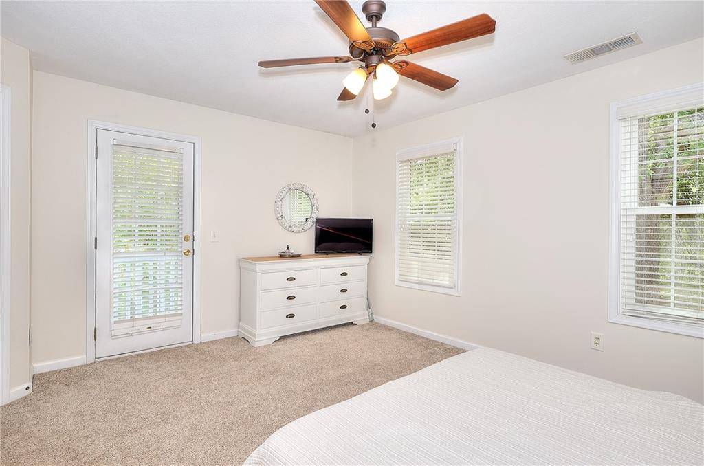 148 Alice Walker Drive Athens, GA 30607 - Photo 16 of 28 a bedroom with a bed dresser and a window