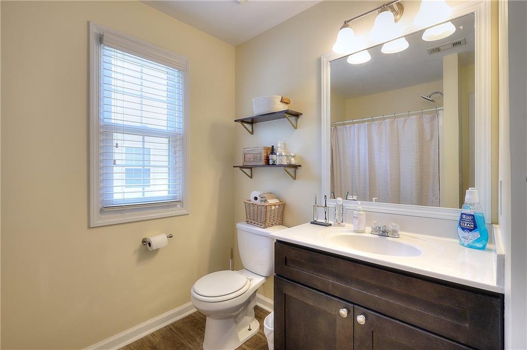 148 Alice Walker Drive Athens, GA 30607 - Photo 17 of 28 a bathroom with a sink and a mirror