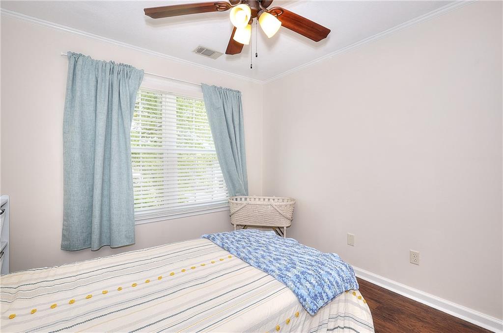 148 Alice Walker Drive Athens, GA 30607 - Photo 18 of 28 a bedroom with a bed and a window
