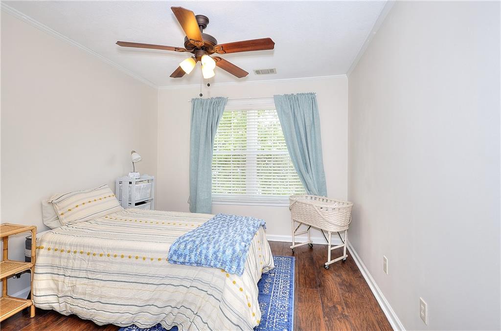 148 Alice Walker Drive Athens, GA 30607 - Photo 19 of 28 a bedroom with a bed and a window