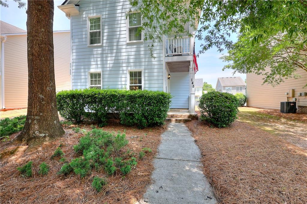 148 Alice Walker Drive Athens, GA 30607 - Photo 2 of 28 a view of a back yard with plants