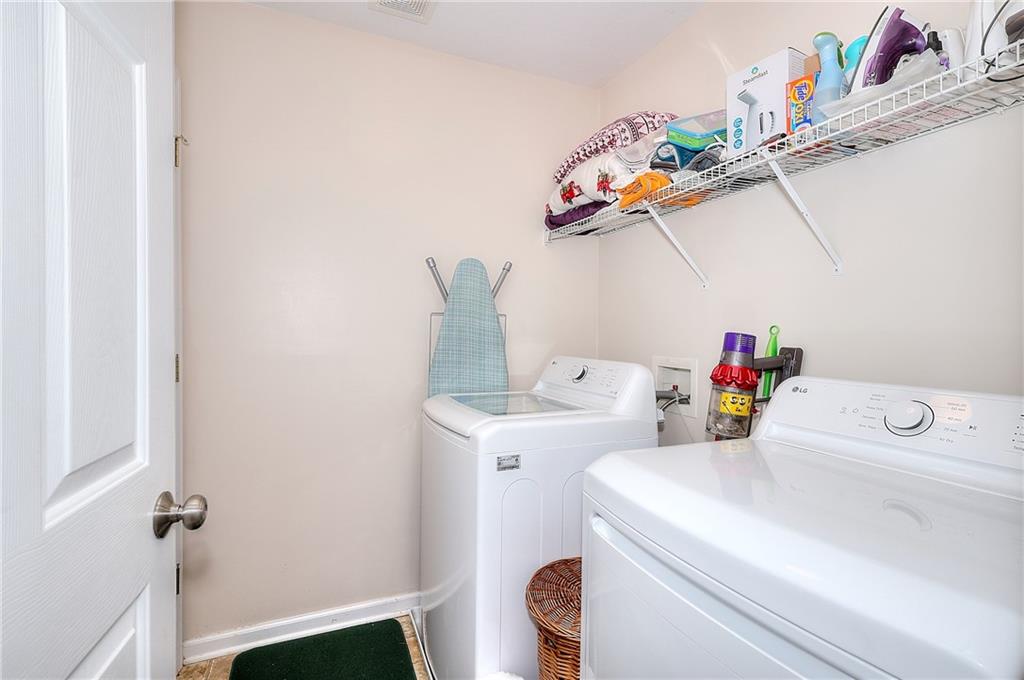 148 Alice Walker Drive Athens, GA 30607 - Photo 24 of 28 a utility room with dryer and washer