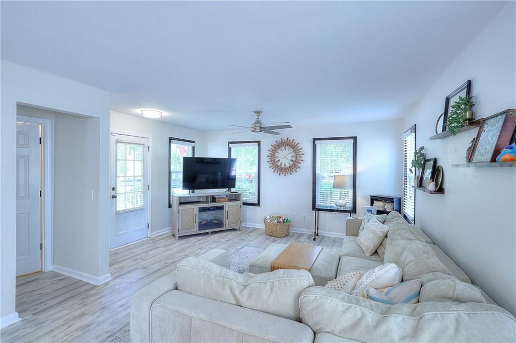 148 Alice Walker Drive Athens, GA 30607 - Photo 4 of 28 a living room with furniture and a flat screen tv