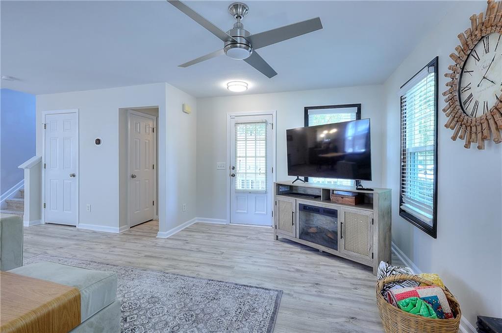 148 Alice Walker Drive Athens, GA 30607 - Photo 7 of 28 a living room with furniture and a flat screen tv