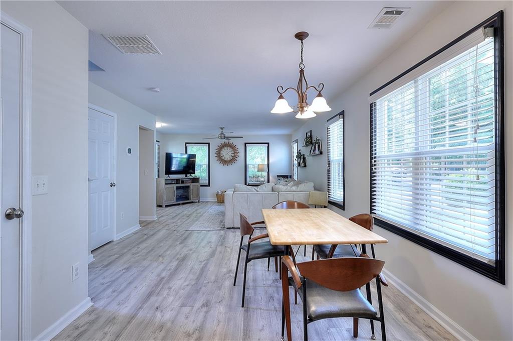148 Alice Walker Drive Athens, GA 30607 - Photo 10 of 28 a view of a dining room with furniture window and wooden floor