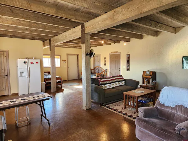 a living room with furniture and a table