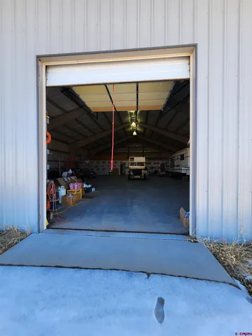 a view of parking garage with cars