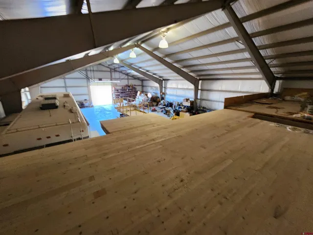 a view of kitchen with furniture and wooden floor