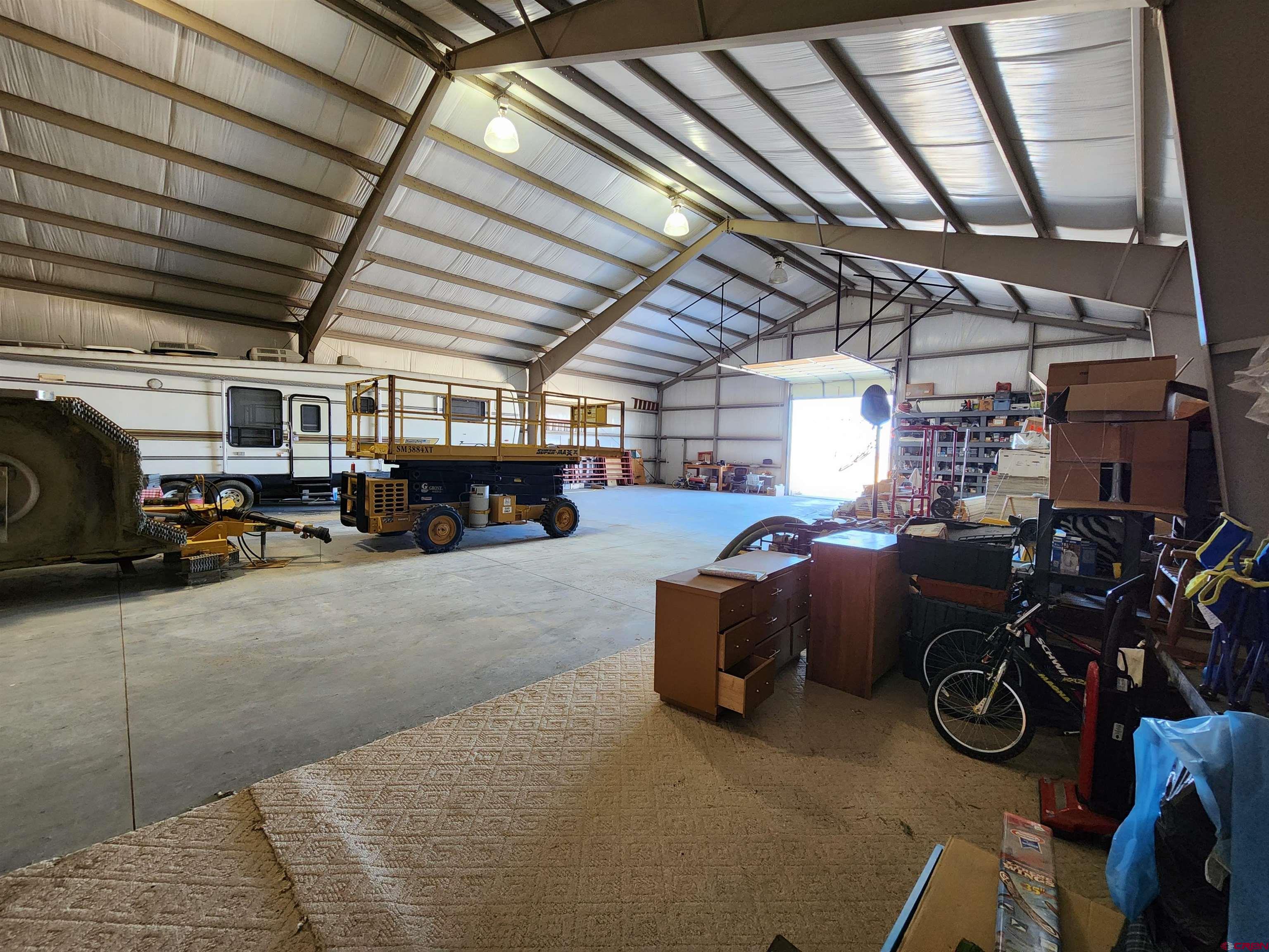 1935 Henderson Road Monte Vista, CO 81144 - Photo 10 of 23 a view of parking garage with cars