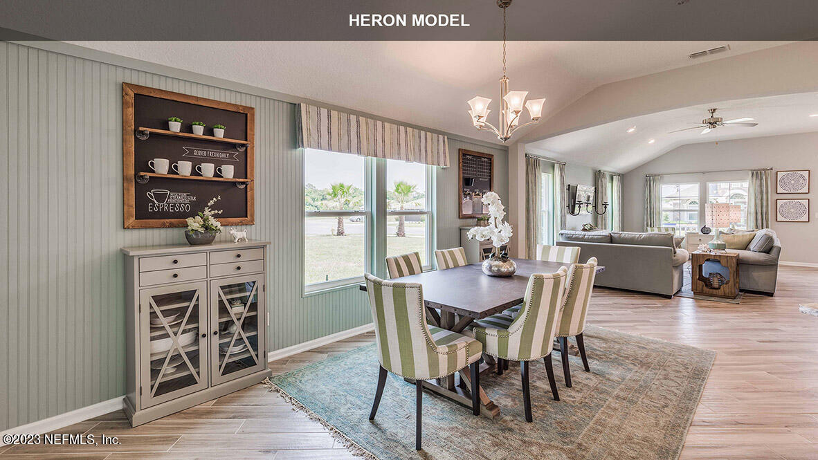 65776 Edgewater Drive Yulee, FL 32097 - Photo 6 of 45 a view of a a dining room with furniture window and wooden floor