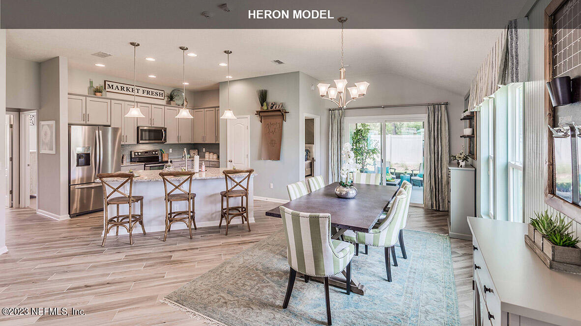 65776 Edgewater Drive Yulee, FL 32097 - Photo 7 of 45 a view of a dining room with furniture