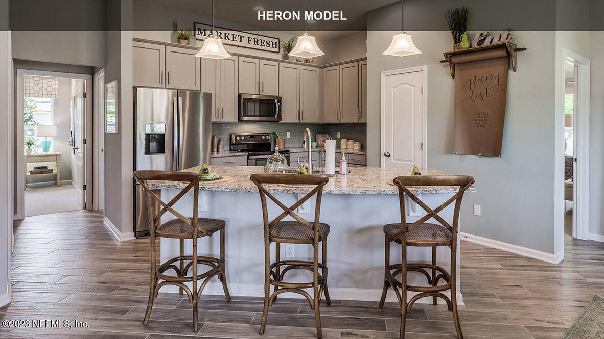 65776 Edgewater Drive Yulee, FL 32097 - Photo 8 of 45 a view of a kitchen with appliances and furniture