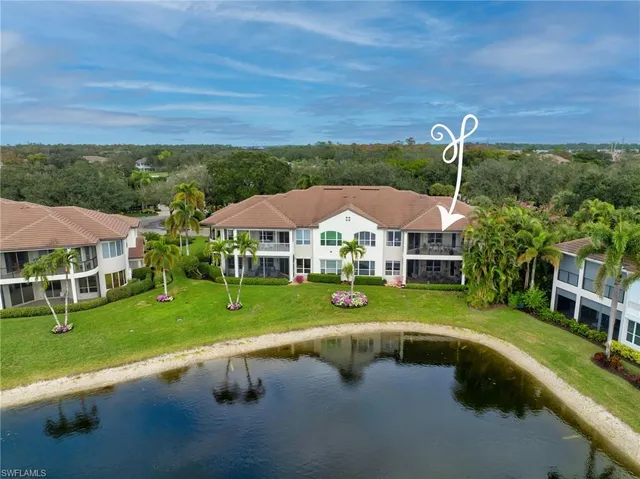 a view of swimming pool and outdoor seating