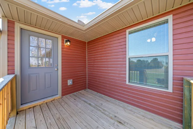 a view of a backyard and wooden floor