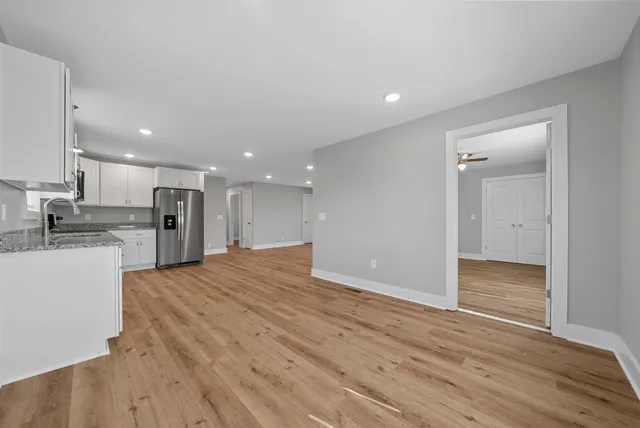 a view of kitchen with wooden floor