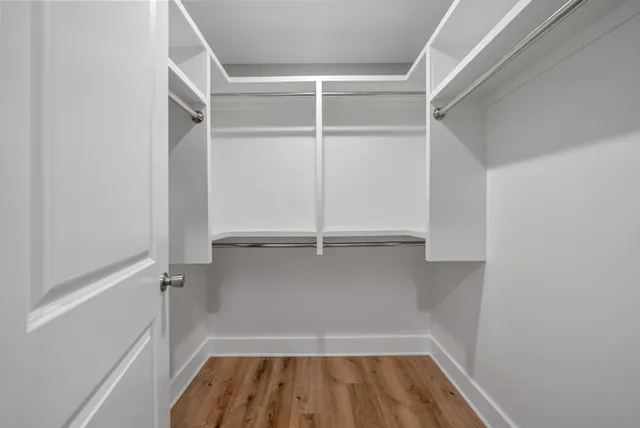 a view of an empty walk in closet